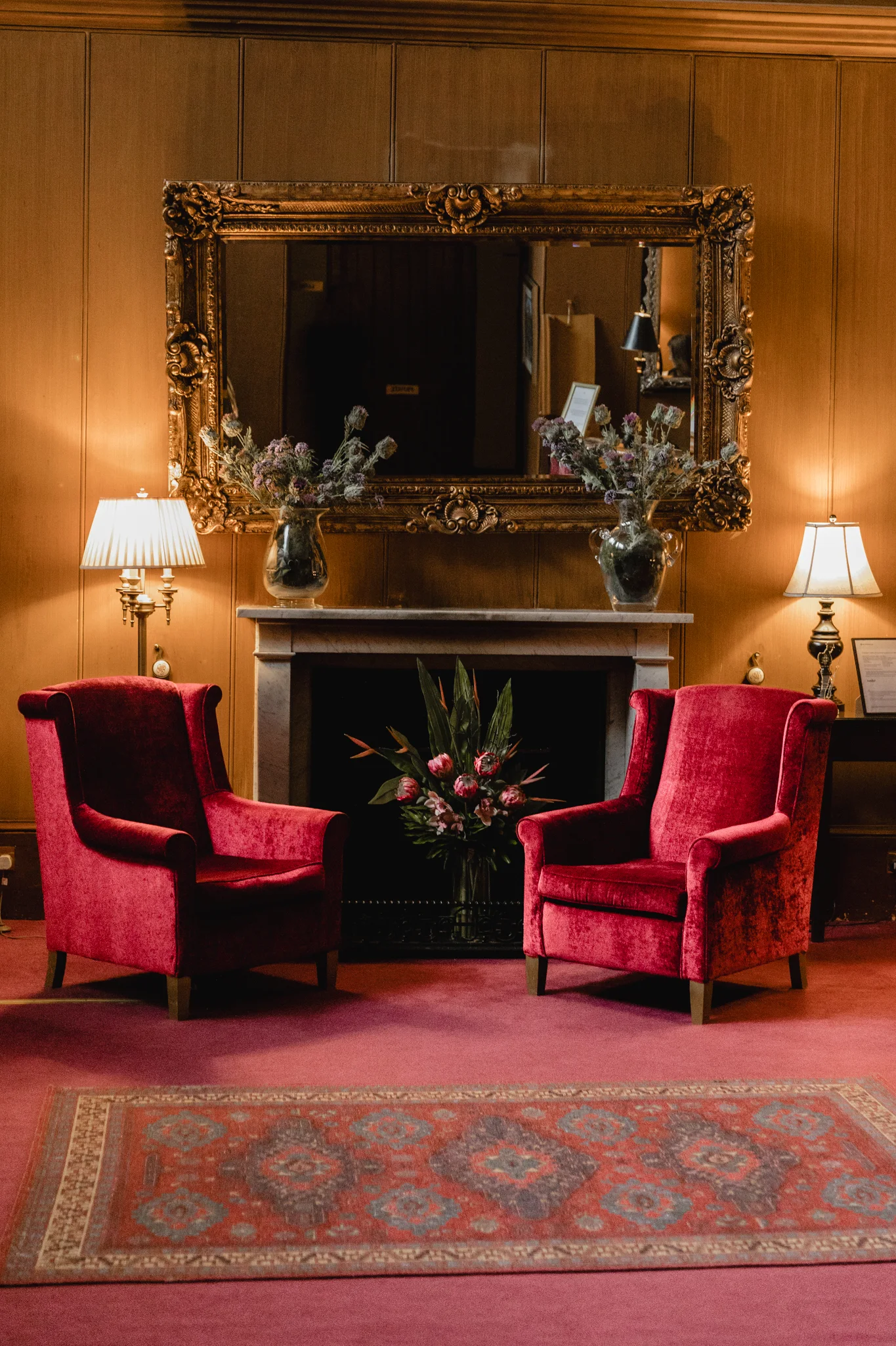 Fireside seating in the restored drawing room at Mar Hall
